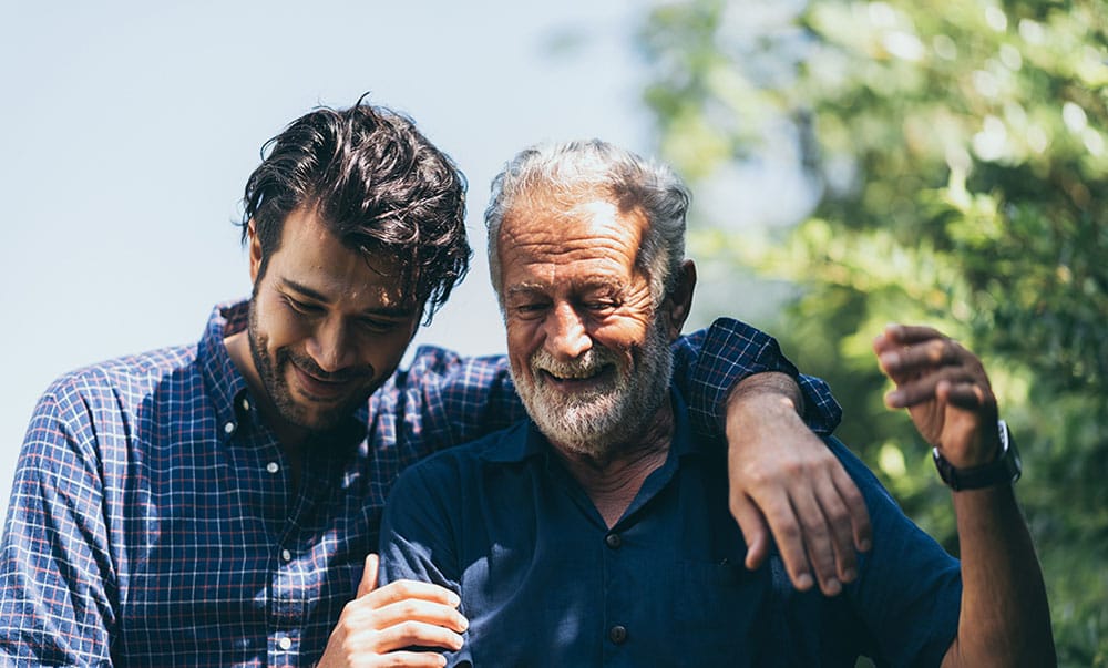 Adult hipster son and old senior father